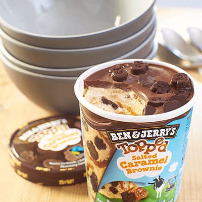 A pint of Topped Salted Caramel Brownie with bowls ready to serve